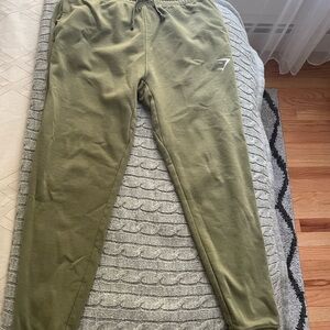 Gymshark, crest joggers, olive green, size M. Good condition but slightly faded.